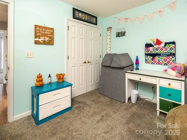 a bed room with a bed and a window