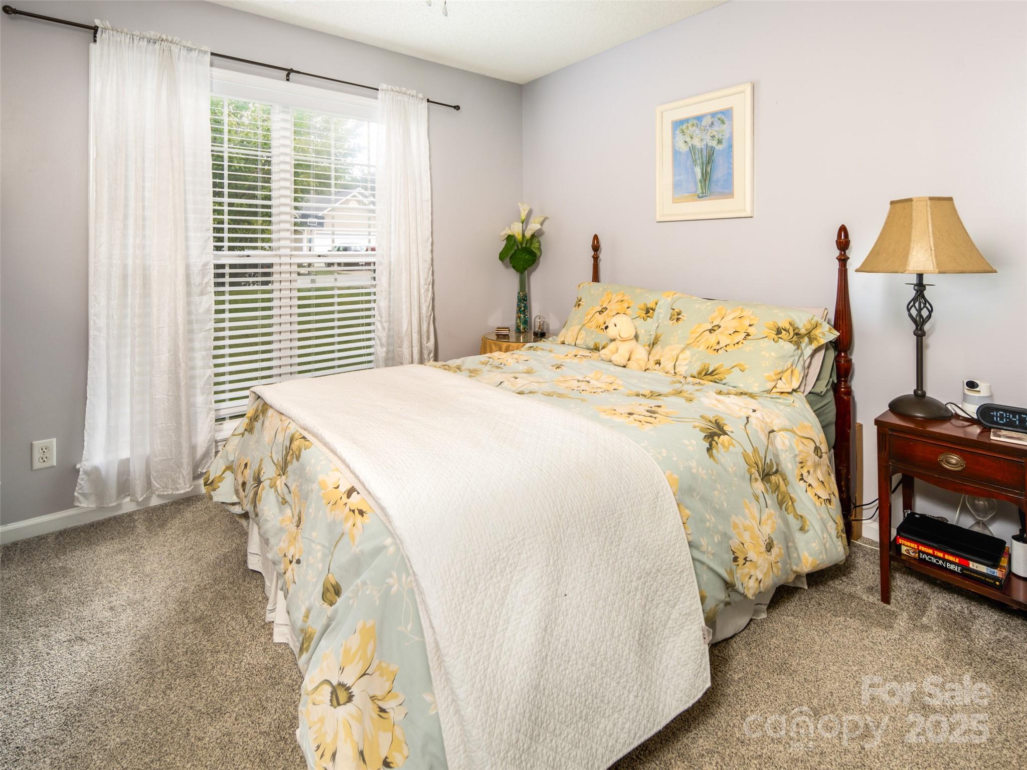 141 Black River Road Fletcher, NC 28732 - Photo 19 of 32 a bedroom with a bed and a window