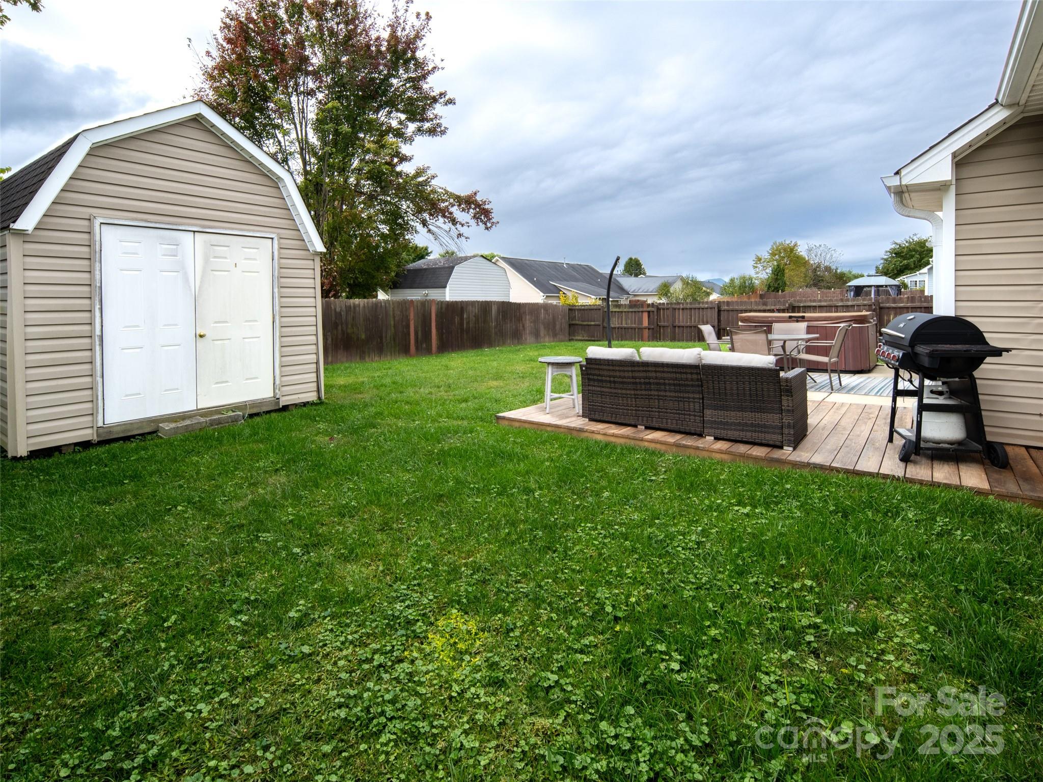 141 Black River Road Fletcher, NC 28732 - Photo 23 of 32 a view of a house with a back yard