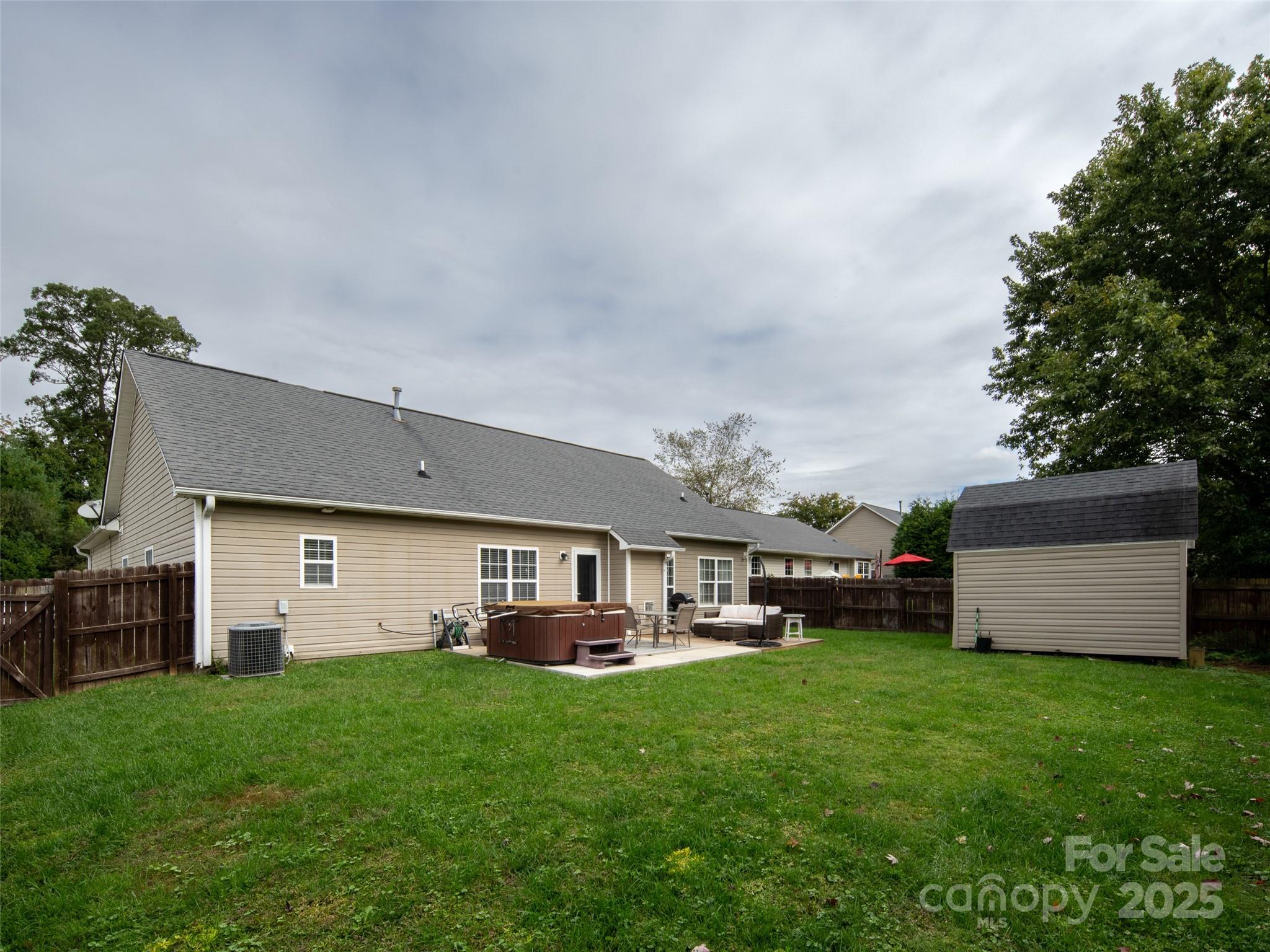 141 Black River Road Fletcher, NC 28732 - Photo 25 of 32 a view of a house with backyard and a garden