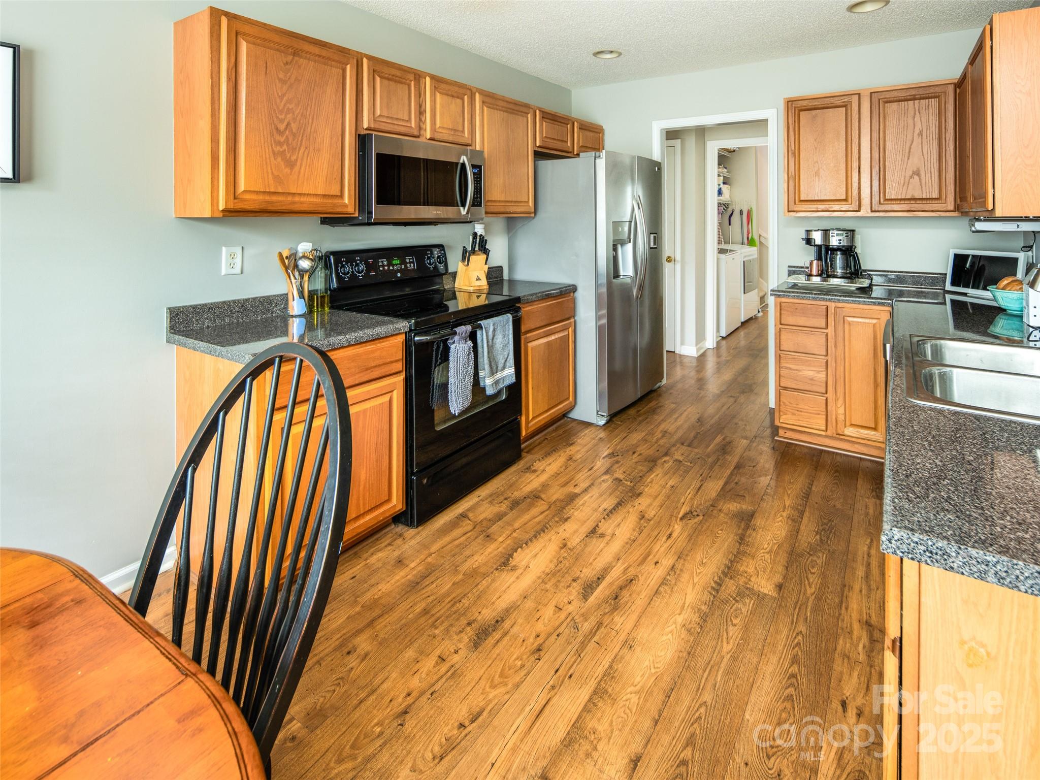 141 Black River Road Fletcher, NC 28732 - Photo 6 of 32 a kitchen with stainless steel appliances granite countertop a refrigerator a stove top oven a sink and dishwasher