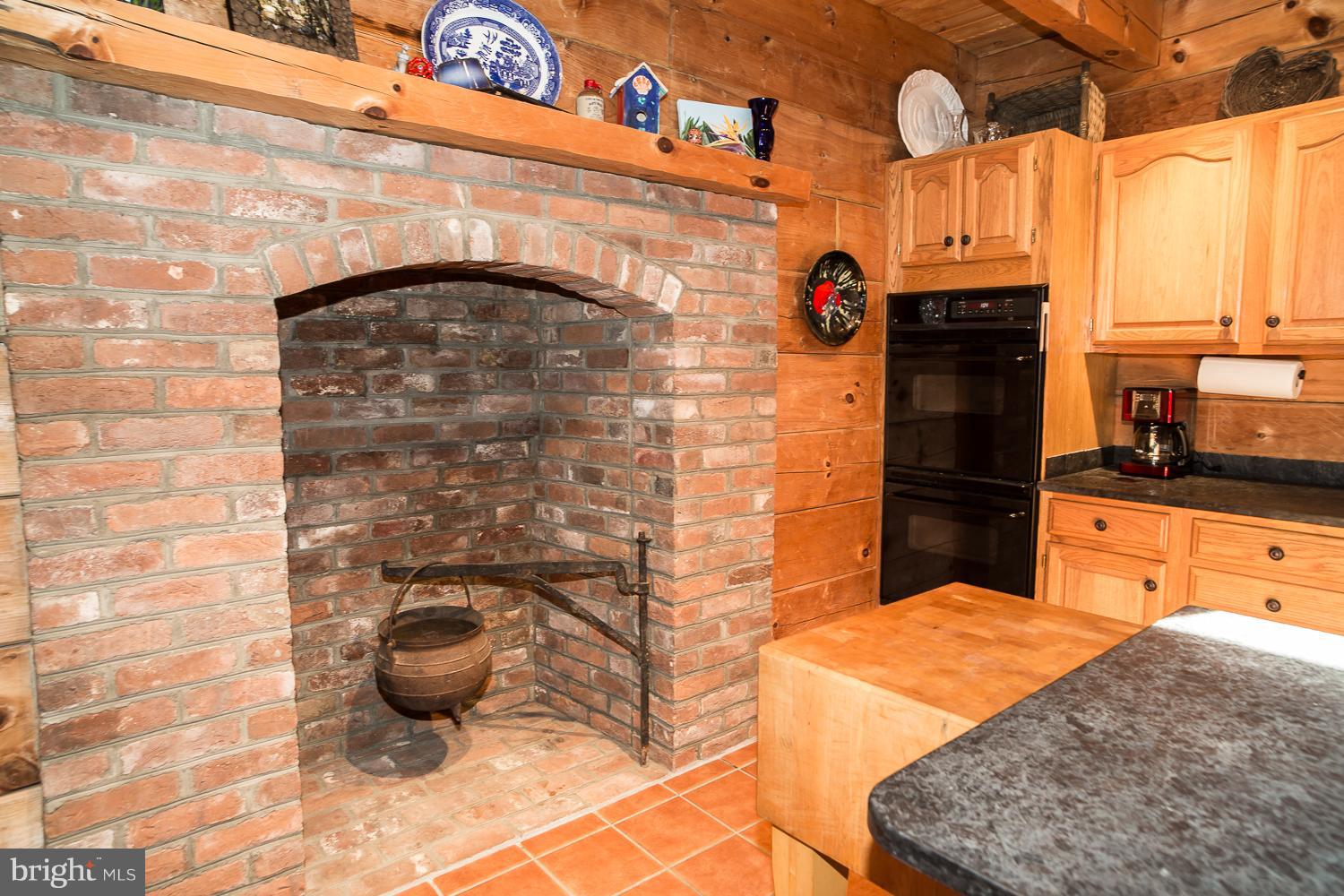 3811 Ebenezer Road Bluemont, VA 20135 - Photo 11 of 30 Wood burning fireplace in kitchen