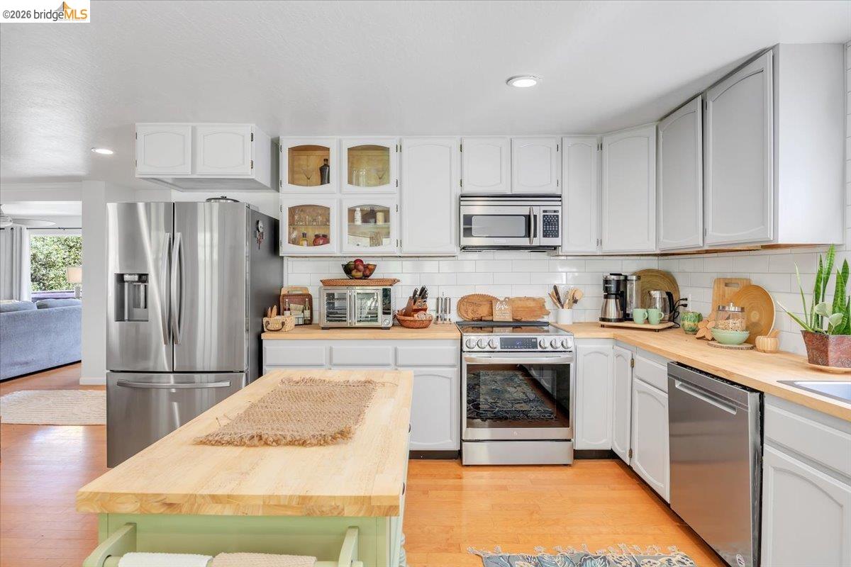 18475 Hershey Road East Tuolumne, CA 95379 - Photo 14 of 38 a kitchen with stainless steel appliances granite countertop a refrigerator sink and cabinets
