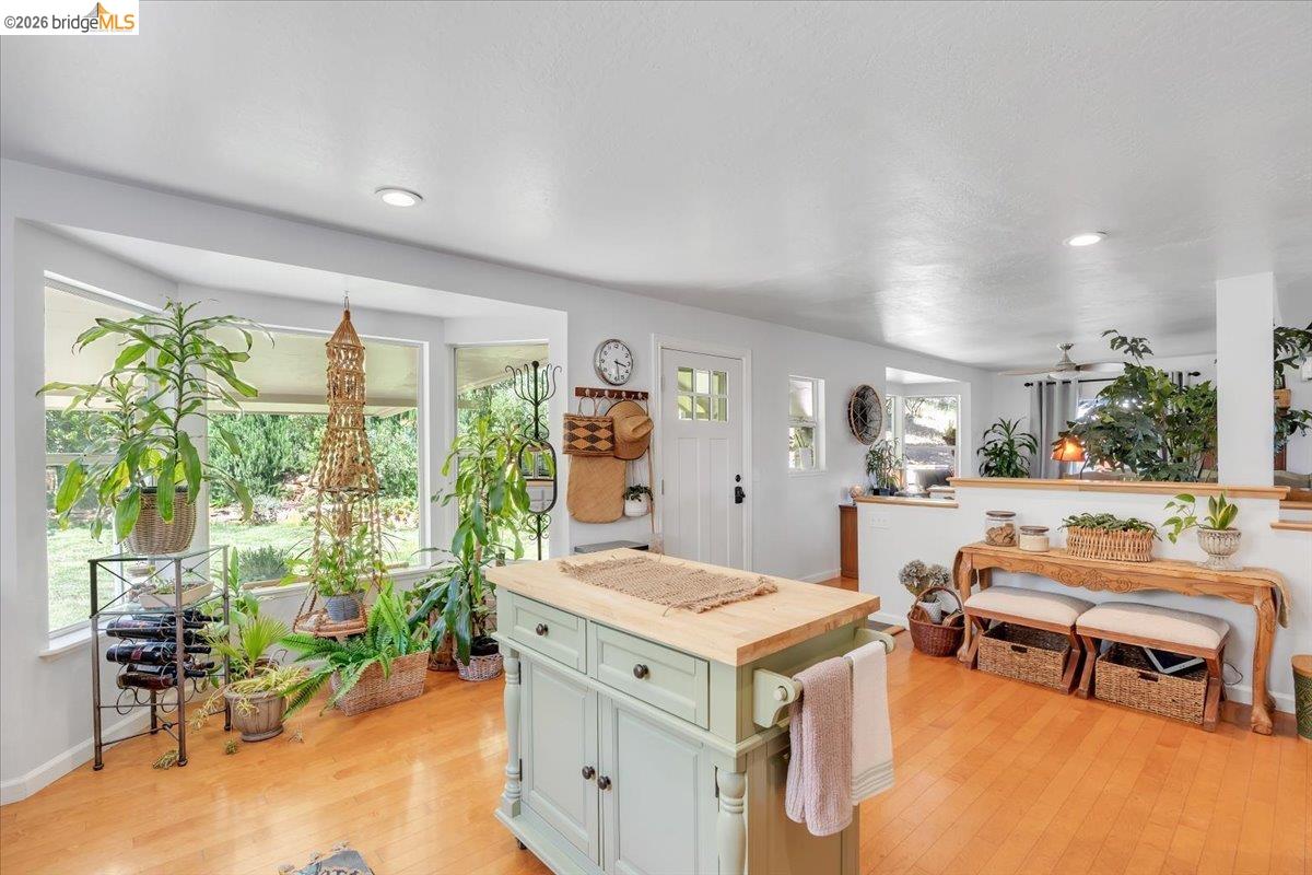 18475 Hershey Road East Tuolumne, CA 95379 - Photo 16 of 38 a living room with furniture a rug potted plant and a large window
