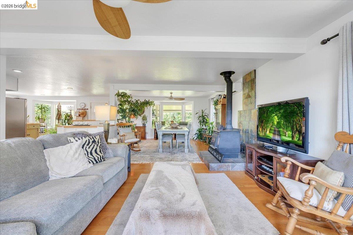 18475 Hershey Road East Tuolumne, CA 95379 - Photo 18 of 38 a living room with furniture and a flat screen tv