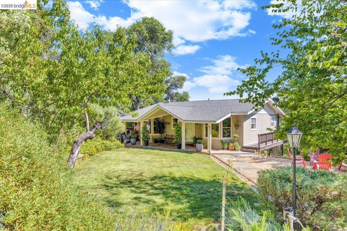 18475 Hershey Road East Tuolumne, CA 95379 - Photo 2 of 38 a front view of a house with a yard