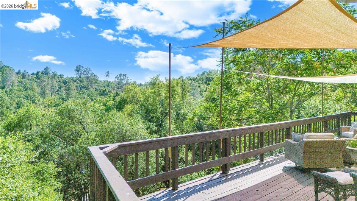 18475 Hershey Road East Tuolumne, CA 95379 - Photo 21 of 38 a view of a chair and table in the balcony