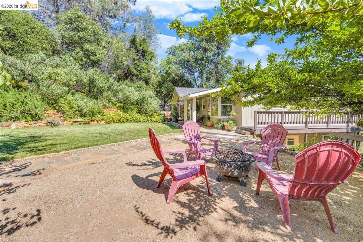 18475 Hershey Road East Tuolumne, CA 95379 - Photo 24 of 38 a view of a deck with chairs and a yard