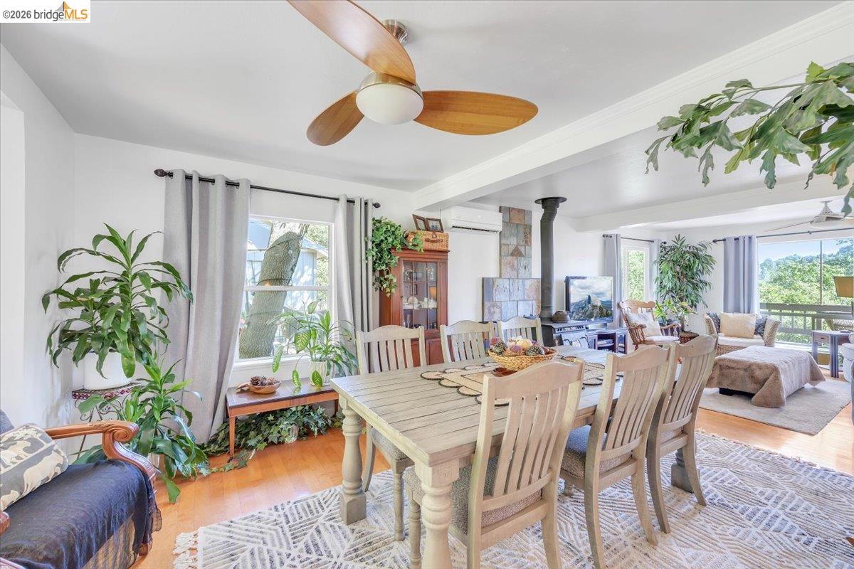 18475 Hershey Road East Tuolumne, CA 95379 - Photo 3 of 38 a dining room with furniture water view and a large window