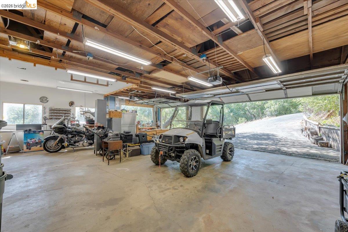 18475 Hershey Road East Tuolumne, CA 95379 - Photo 32 of 38 a view of parking garage with cars