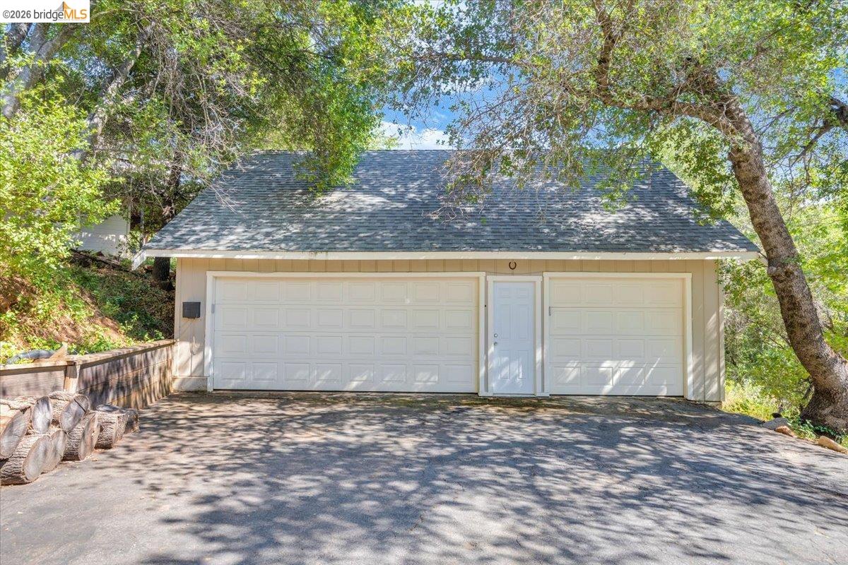 18475 Hershey Road East Tuolumne, CA 95379 - Photo 33 of 38 a view of a house with a yard