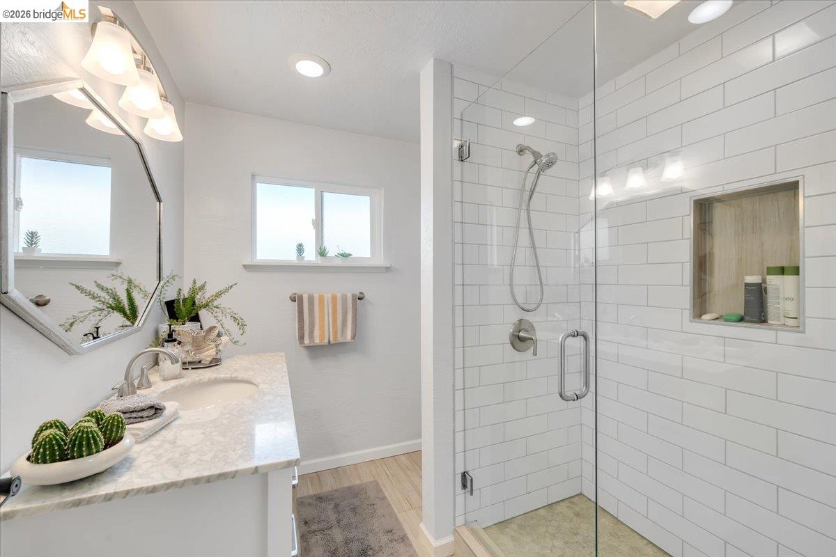 18475 Hershey Road East Tuolumne, CA 95379 - Photo 8 of 38 a bathroom with a granite countertop shower a mirror and vanity
