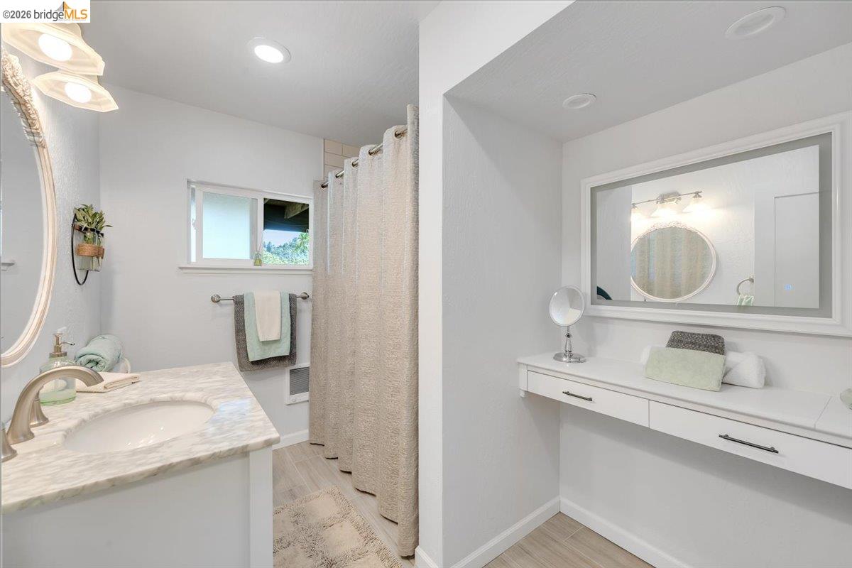 18475 Hershey Road East Tuolumne, CA 95379 - Photo 10 of 38 a en suite bathroom with a granite countertop sink and a mirror