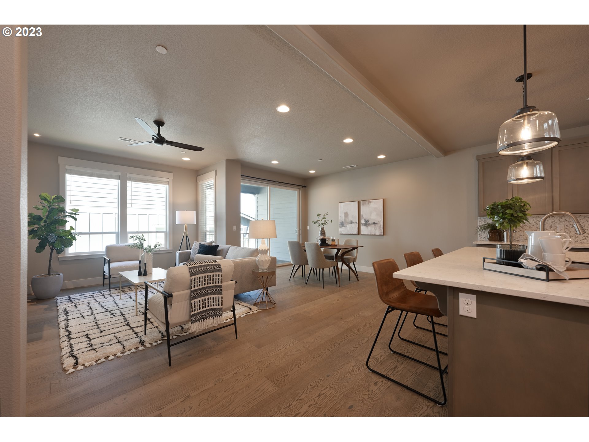 3743 Northwest 64th Avenue Camas, WA 98607 - Photo 11 of 35 a living room with furniture a chandelier and a dining table