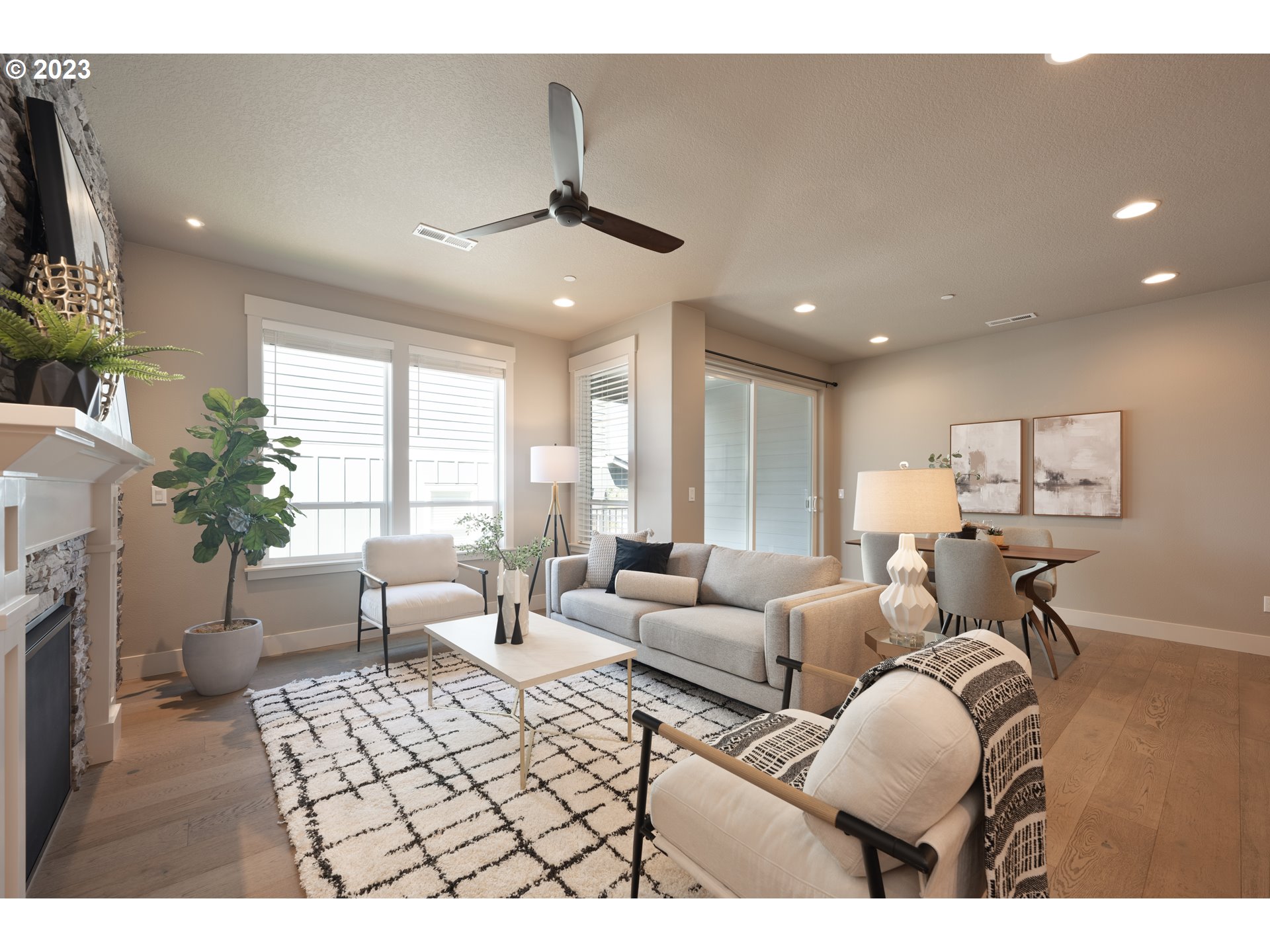 3743 Northwest 64th Avenue Camas, WA 98607 - Photo 5 of 35 a living room with furniture a chandelier and a flat screen tv