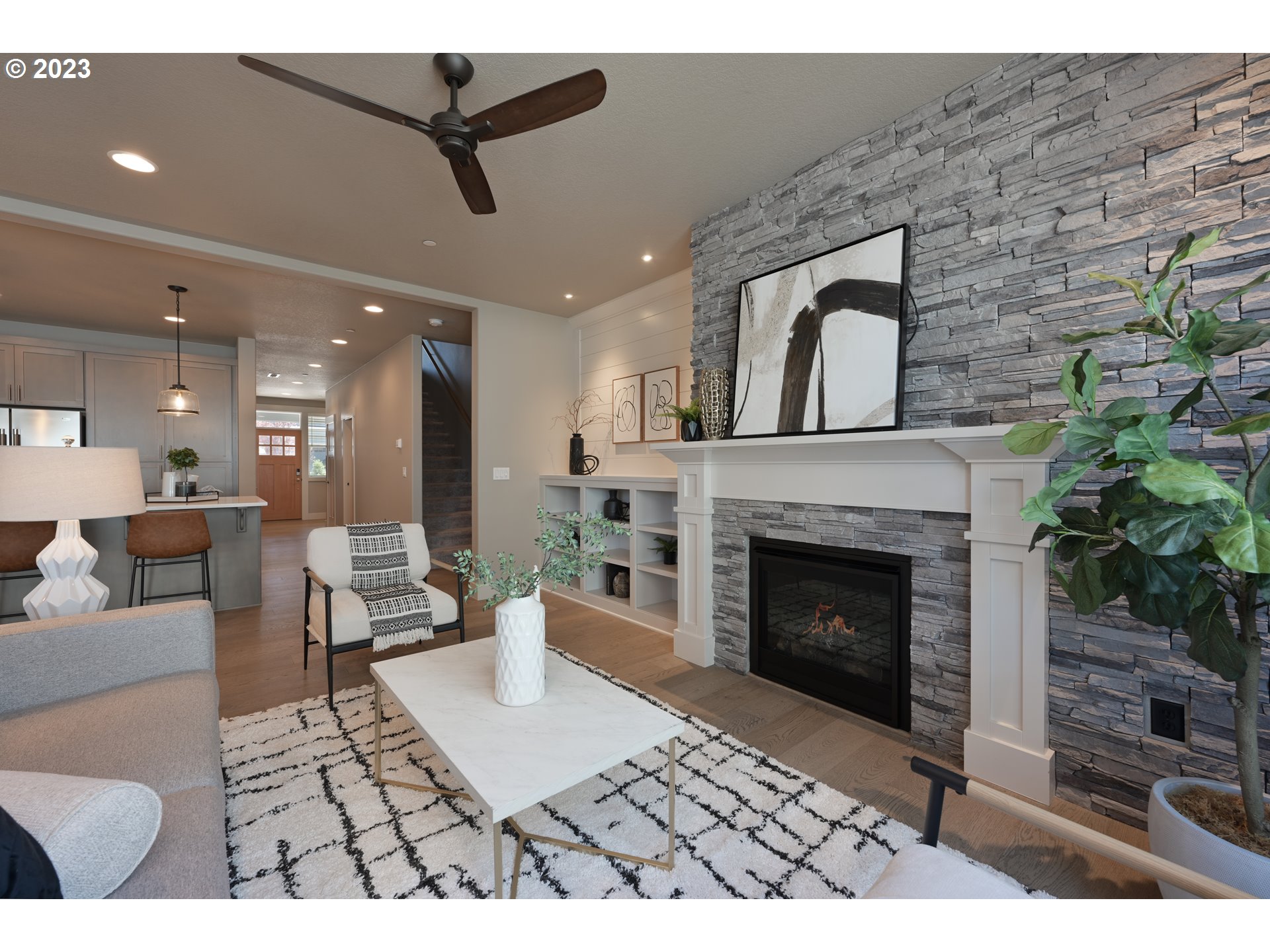 3743 Northwest 64th Avenue Camas, WA 98607 - Photo 6 of 35 a living room with furniture a fireplace and a potted plant
