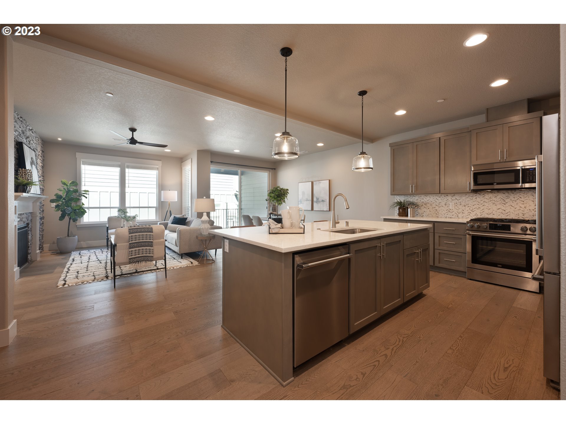 3743 Northwest 64th Avenue Camas, WA 98607 - Photo 10 of 35 a kitchen with stainless steel appliances granite countertop a sink counter space and cabinets