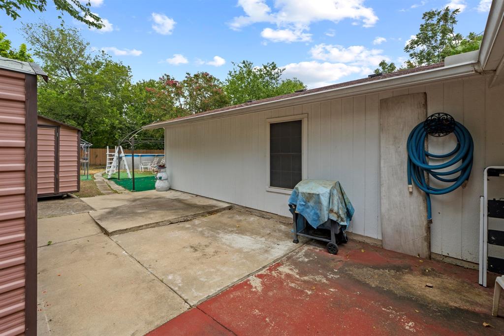 4604 Munson Street Austin, TX 78721 - Photo 17 of 18 View of patio / terrace with a grill and a storage shed