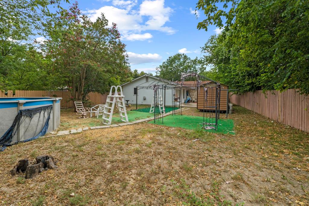 4604 Munson Street Austin, TX 78721 - Photo 18 of 18 Fenced backyard featuring a patio