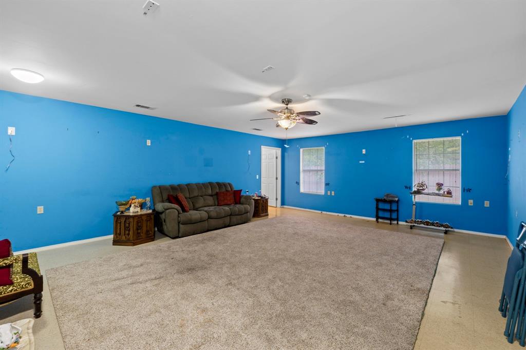 4604 Munson Street Austin, TX 78721 - Photo 9 of 18 Living room with ceiling fan and plenty of natural light