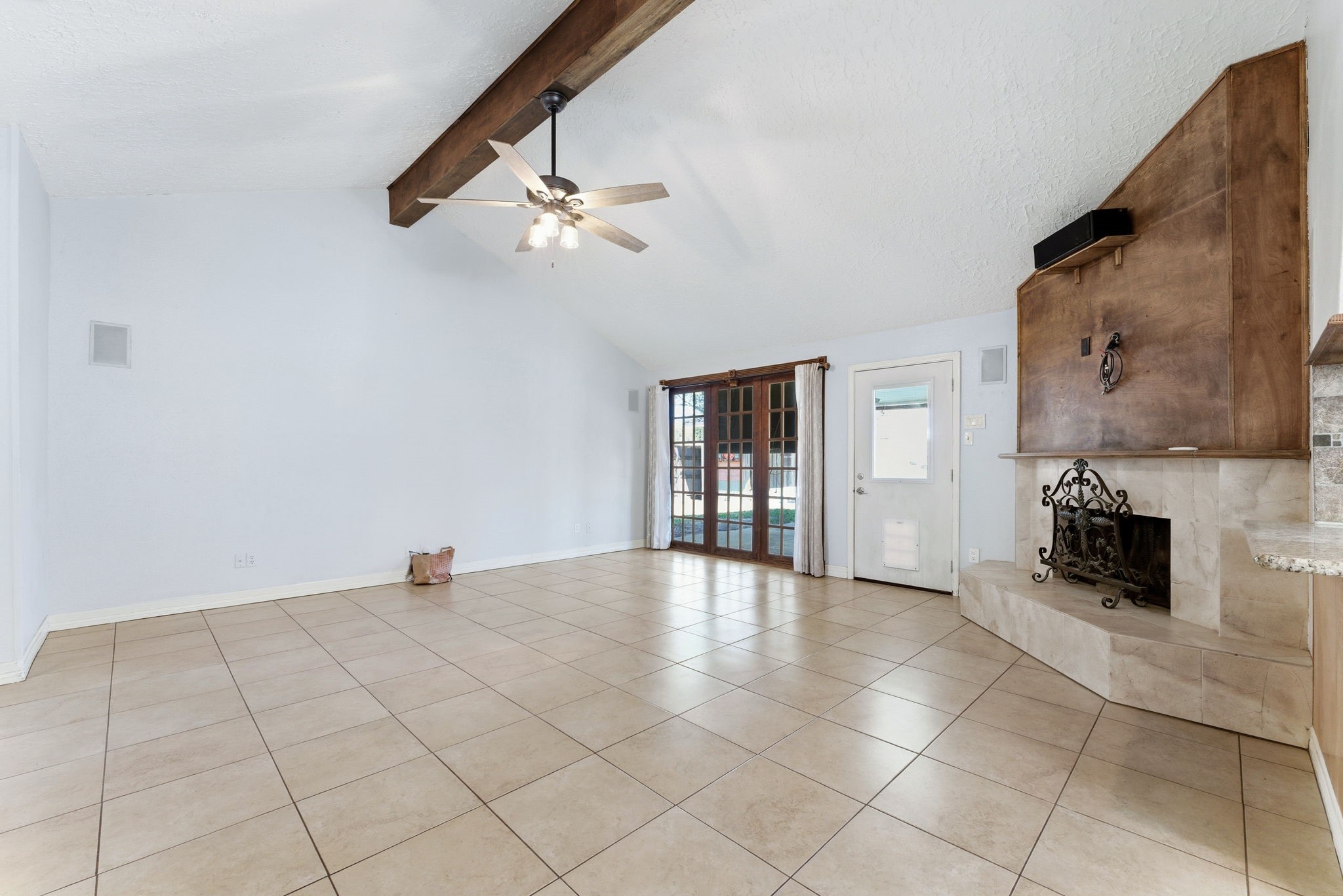 21514 Slippery Creek Lane Spring, TX 77388 - Photo 7 of 27 a view of an empty room with a fireplace and a chandelier