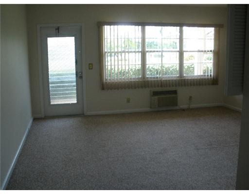91 Brighton C, Unit 91 Boca Raton, FL 33434 - Photo 2 of 6 a view of an empty room with a window
