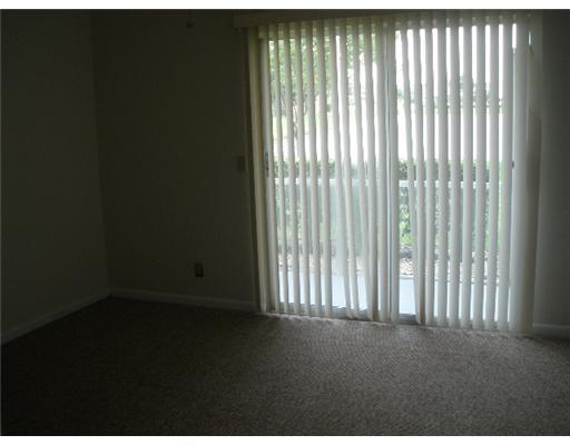 91 Brighton C, Unit 91 Boca Raton, FL 33434 - Photo 5 of 6 a view of an empty room with a window