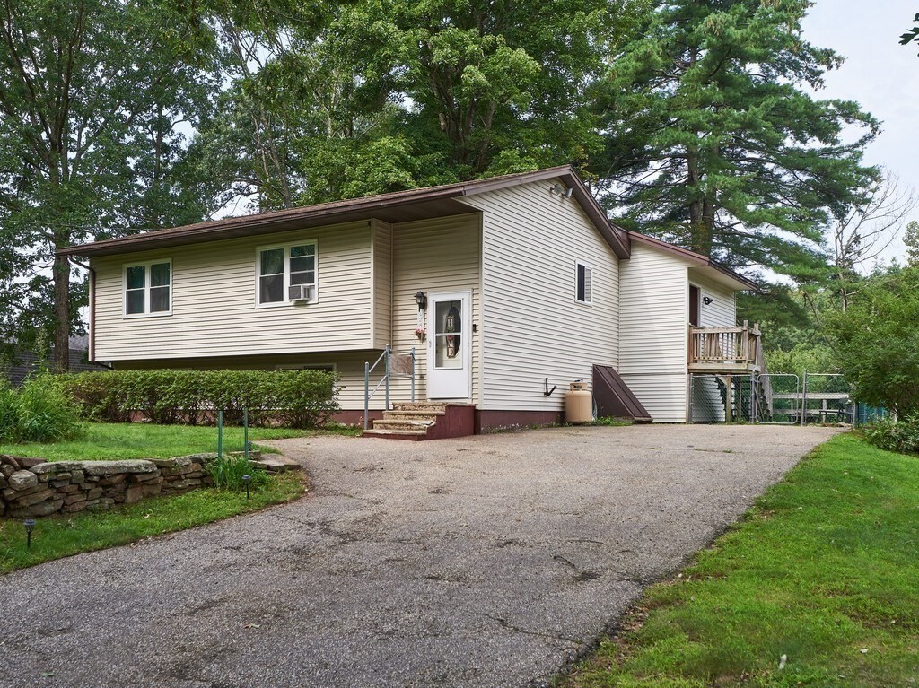 428 Keys Road Warren, MA 01585 - Photo 3 of 26 a house that has a tree in front of the house