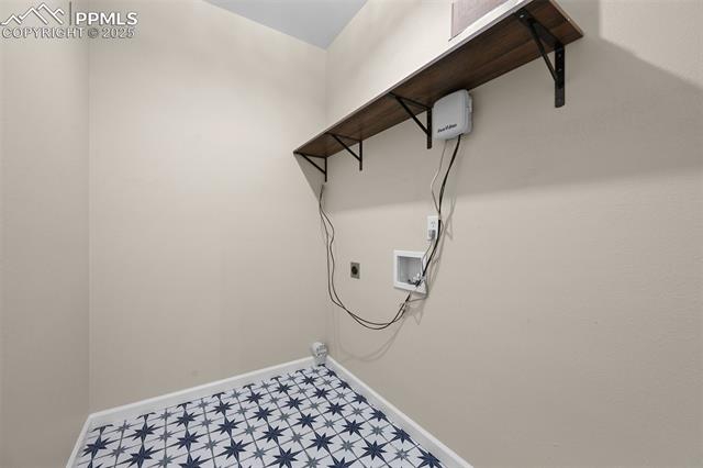 5428 Rondo Way Colorado Springs, CO 80911 - Photo 17 of 43 Laundry room on main floor with washer hookup and hookup for an electric dryer