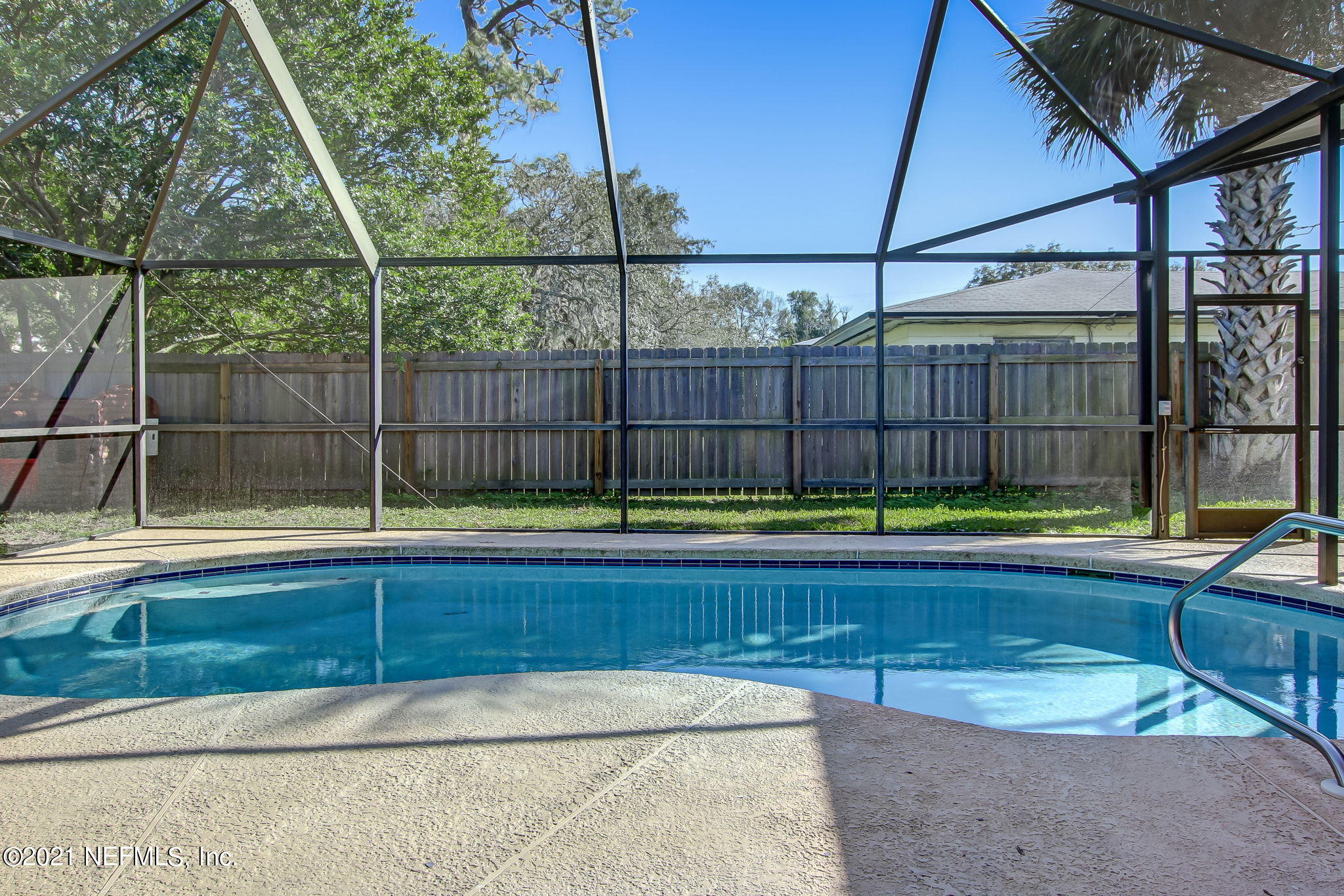 a view of a backyard with a small swimming pool
