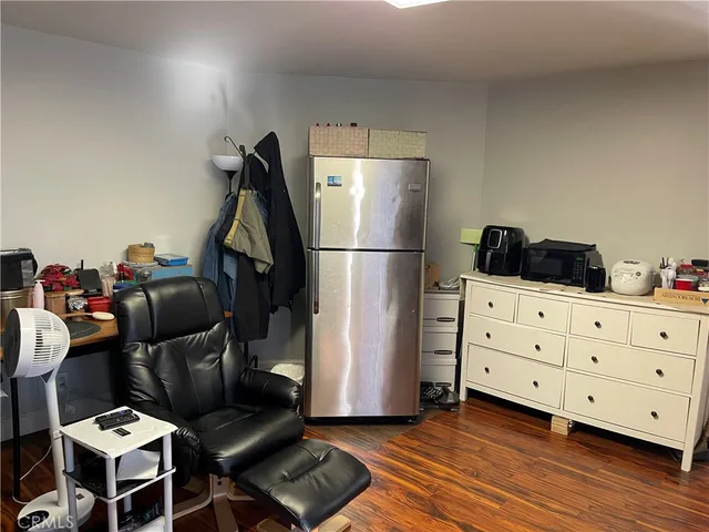 a room with furniture and wooden floor