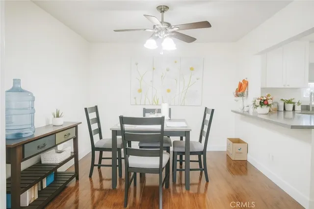 a kitchen with sink cabinets and wooden floor