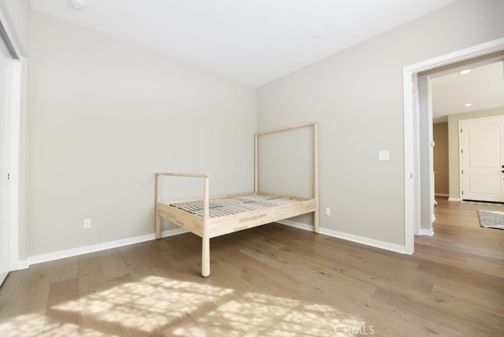 338 Floral View Irvine, CA 92618 - Photo 11 of 23 a view of a room with wooden floor and cabinet