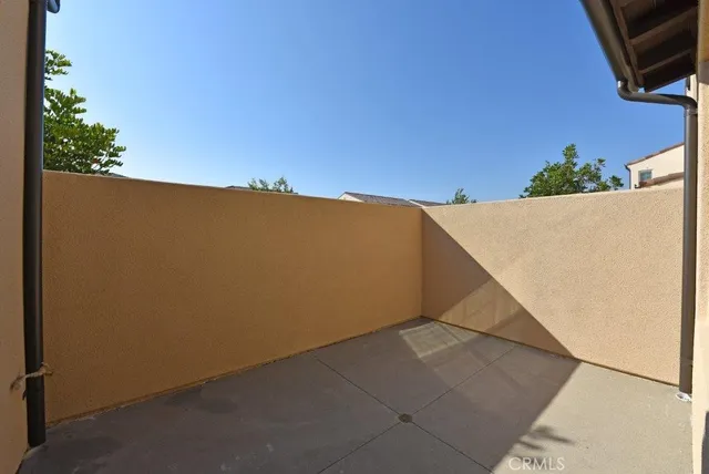 a view of balcony with furniture