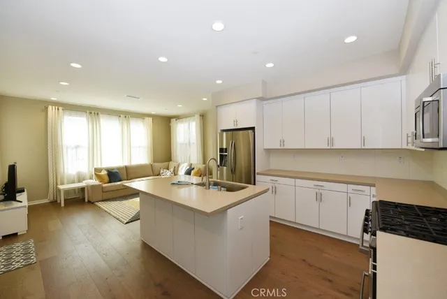 a view of a livingroom with furniture and a window