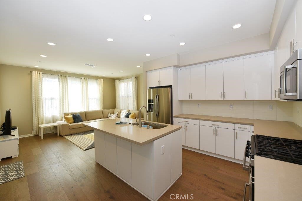 338 Floral View Irvine, CA 92618 - Photo 15 of 23 a kitchen with sink refrigerator and window
