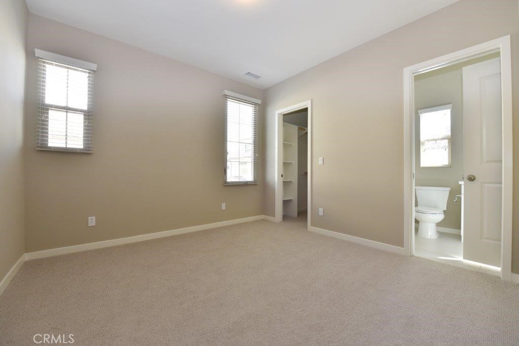338 Floral View Irvine, CA 92618 - Photo 23 of 23 an empty room with windows and bathroom