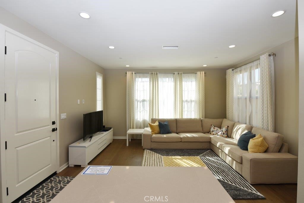 338 Floral View Irvine, CA 92618 - Photo 7 of 23 a living room with furniture and a window