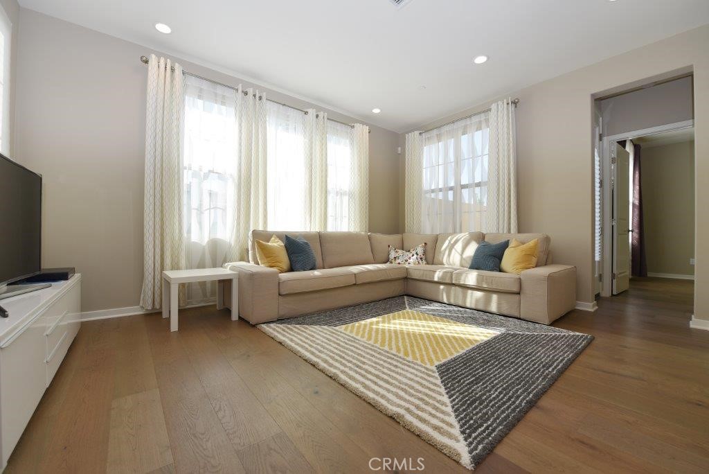 338 Floral View Irvine, CA 92618 - Photo 8 of 23 a living room with furniture and a flat screen tv