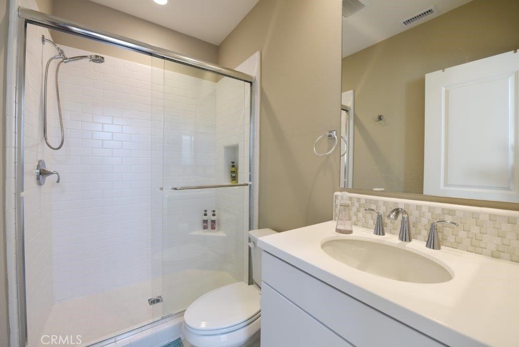 338 Floral View Irvine, CA 92618 - Photo 9 of 23 a bathroom with a sink toilet and shower