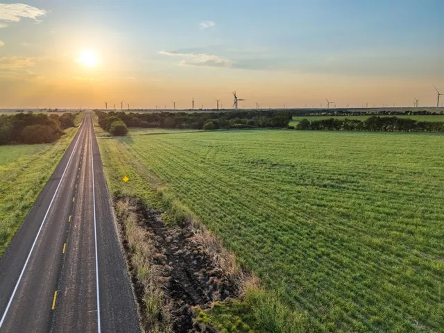 a view of a lake with a big yard