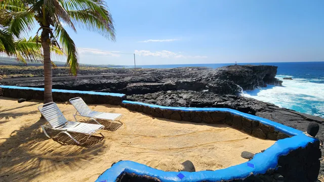 a view of a swimming pool with a lounge chair