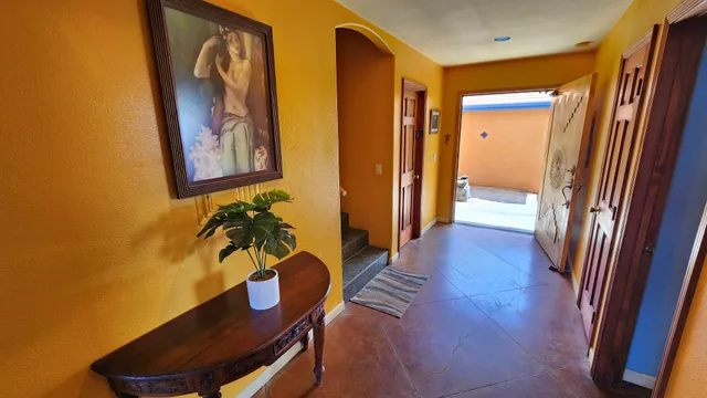 a view of a hallway with chairs