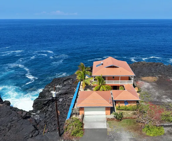a view of swimming pool with an ocean view