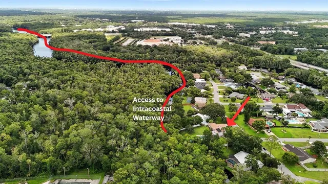 a view of a wooden deck and a yard