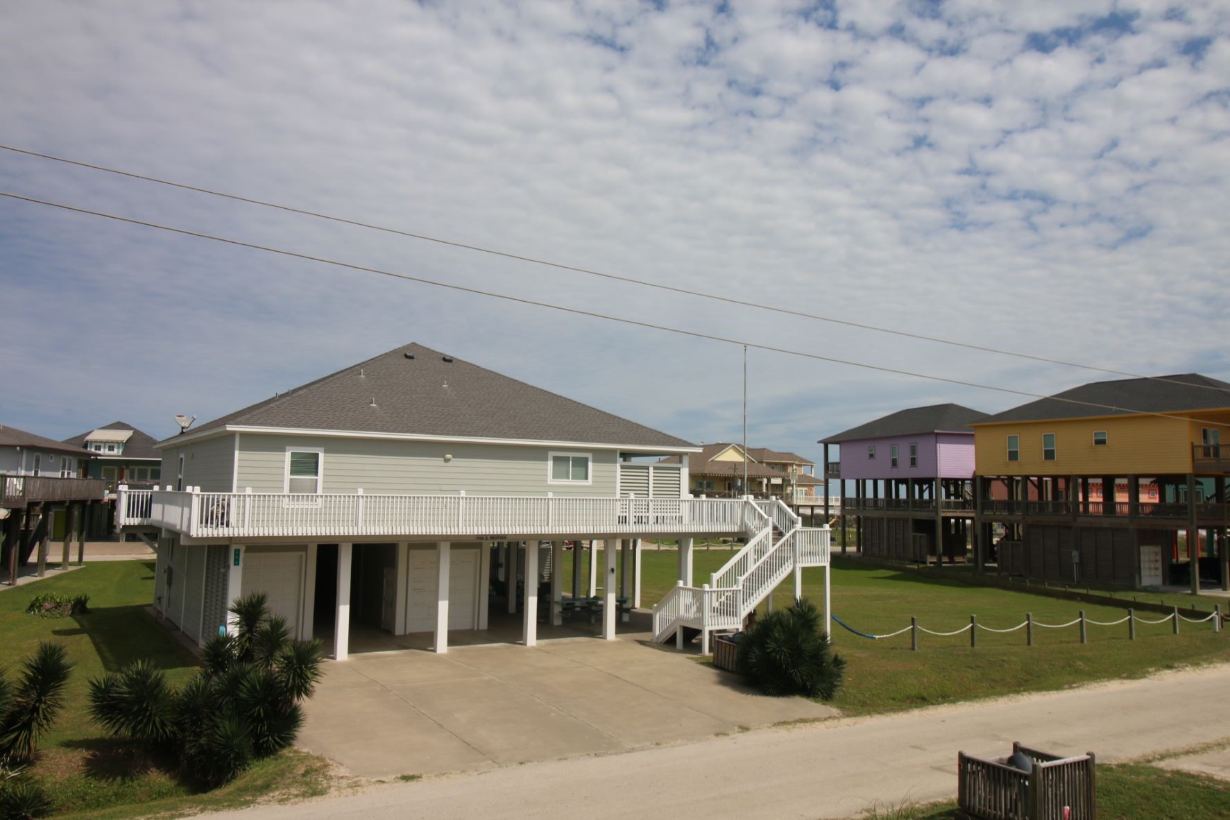 956 South Redfish Crystal Beach, TX 77650 - Photo 18 of 20 a front view of a house with garden