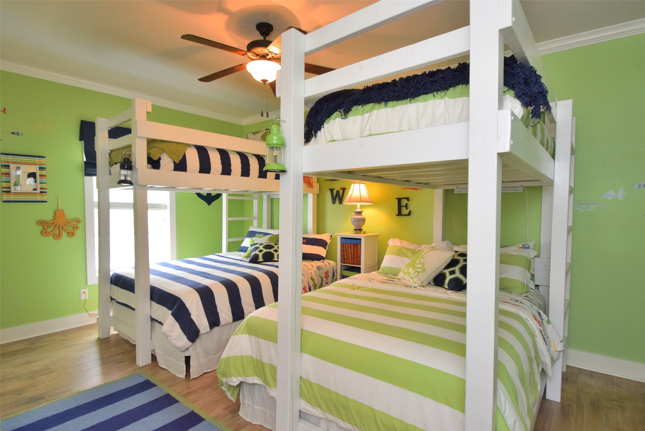 956 South Redfish Crystal Beach, TX 77650 - Photo 19 of 20 a bedroom with two beds and a large window
