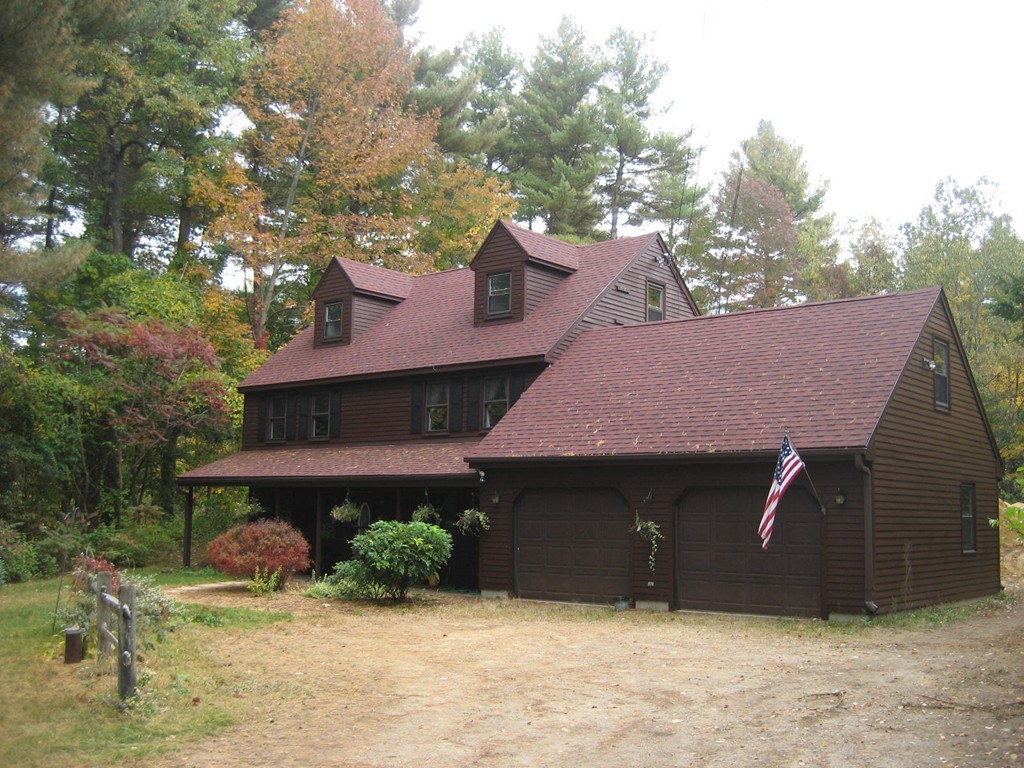 53 Breakneck Road Sturbridge, MA 01566 - Photo 1 of 22 a front view of a house with garden