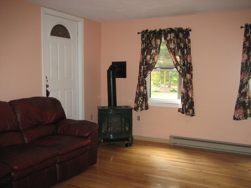 53 Breakneck Road Sturbridge, MA 01566 - Photo 10 of 22 a living room with furniture and a window