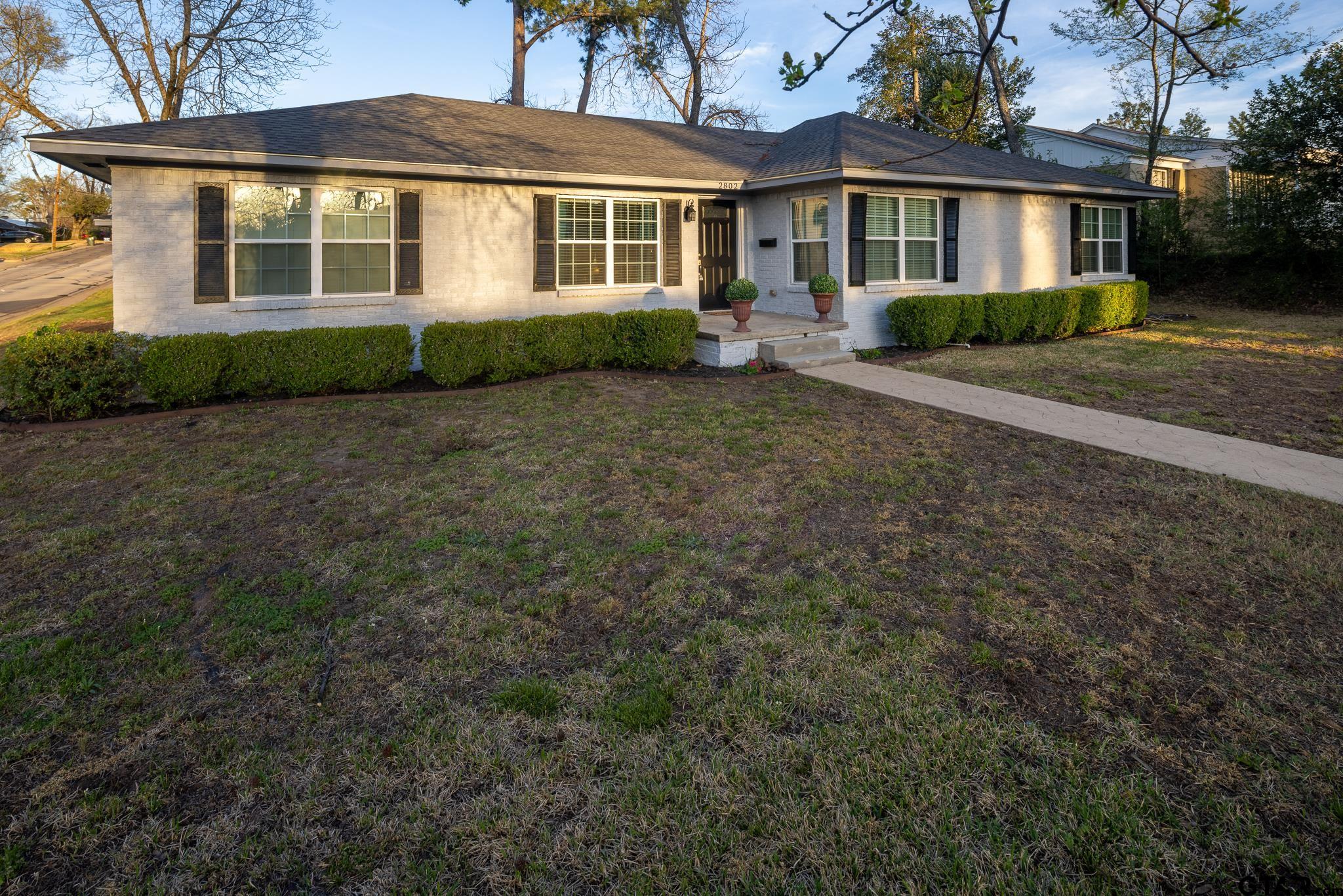 2802 Pollard Drive Tyler, TX 75701 - Photo 1 of 38 a front view of a house with a yard and porch